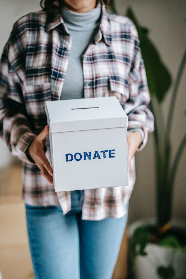 woman holding donation box